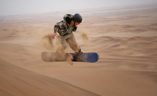 Sand surfing